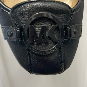 MK black leather ballet flats